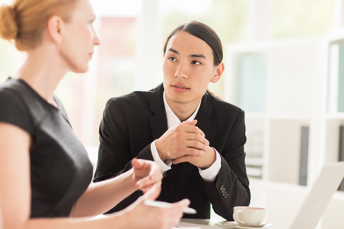 employee in a meeting with team member